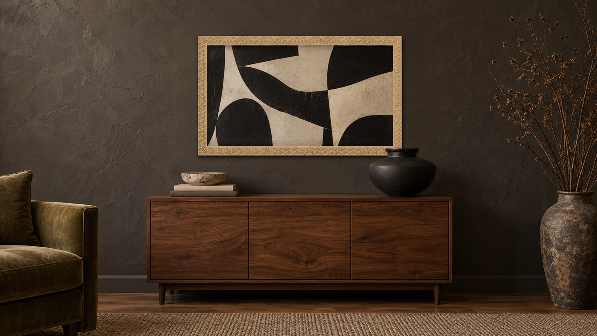 	Shop ornate picture frames, featuring the Glimmer champagne gold frame with bold abstract art on a dark wall